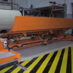 Transfer car from cutter to slat conveyor with roll separation using Roller covers.