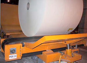 Application with vertical conveyor and turntable on belt conveyor
